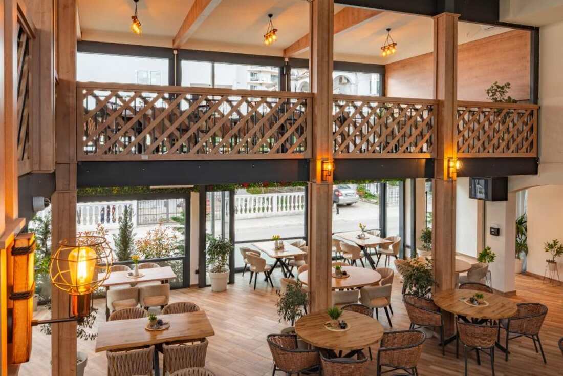 Warm dining area at Hotel Mondo with plants